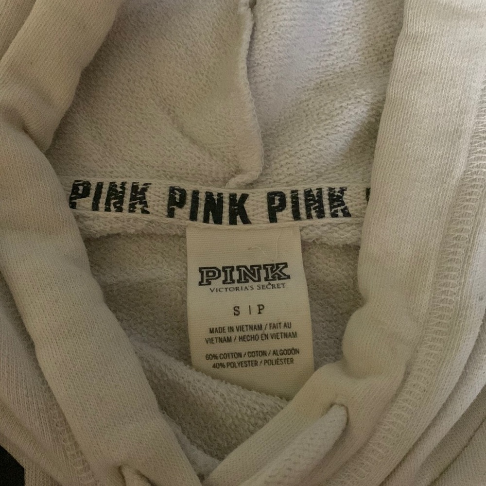 White hoodie with grey and black writing
